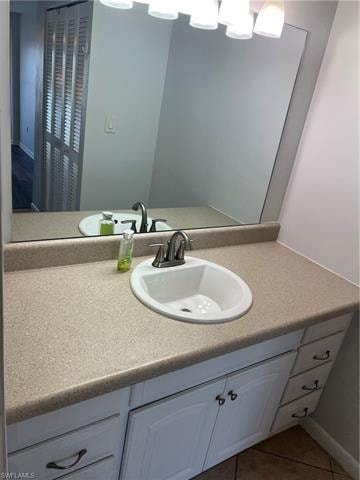 Bathroom featuring vanity and light tile patterned floors