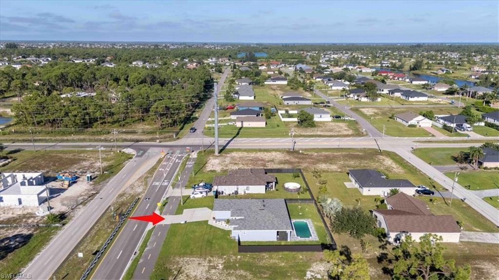 Aerial overview of property's location with nearby suburban area