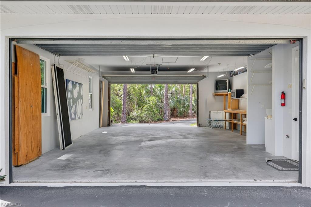 4 car garage with tall garage doors in front and back!