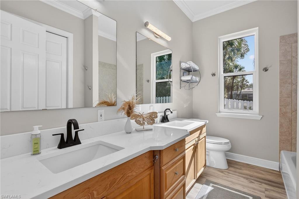 Full bathroom situated between bedroom 3 and 4. Dual sinks, tub/shower combination.