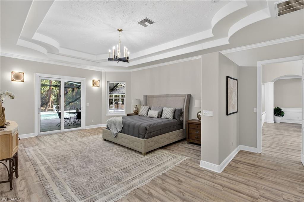 Spacious Primary Bedroom with sliders out to lanai-located on the west wing of the house.