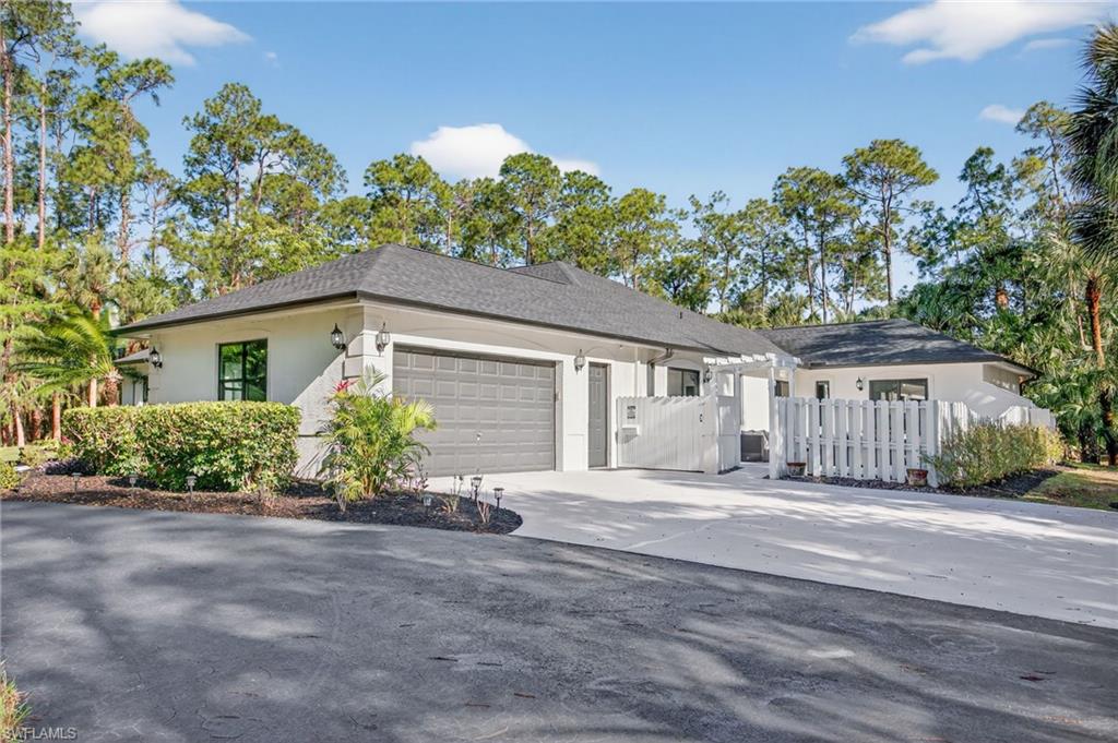 Driveway brings you to all 3 buildings on the property...this is the oversized 2 car garage at the main house.