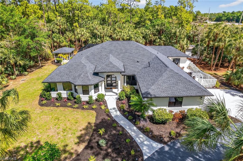 Lushly landscaped, new roof, new impact doors, new everything...Welcome Home!
