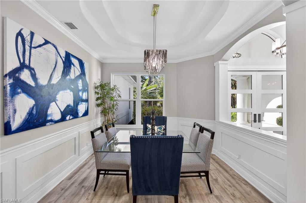 Spacious dining room with detailed walls and ceiling!