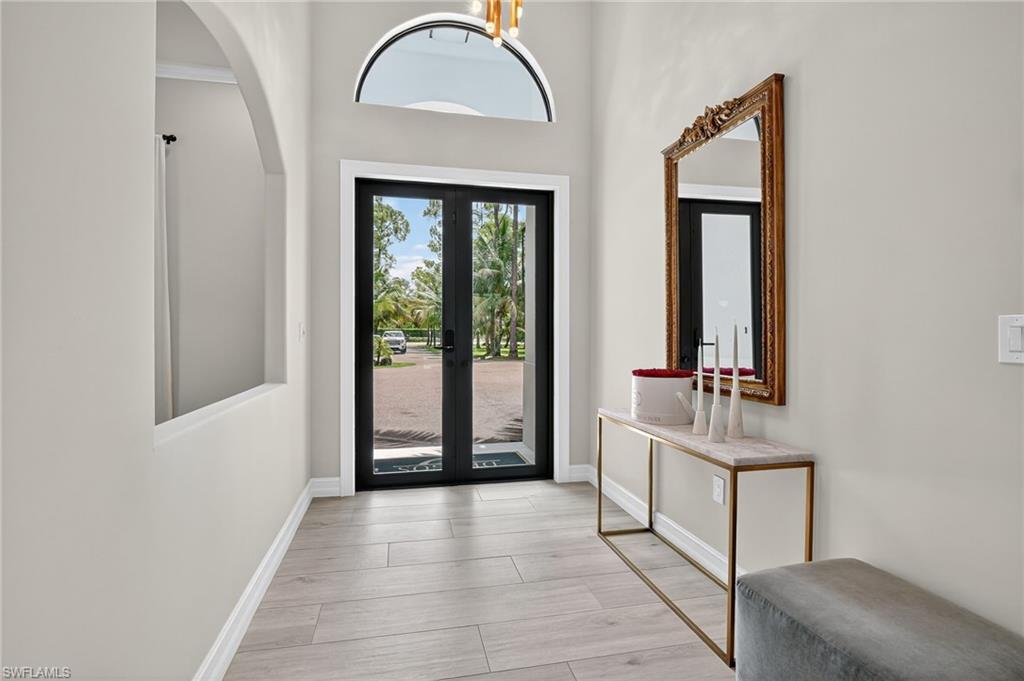 Foyer with a high ceiling and french doors
