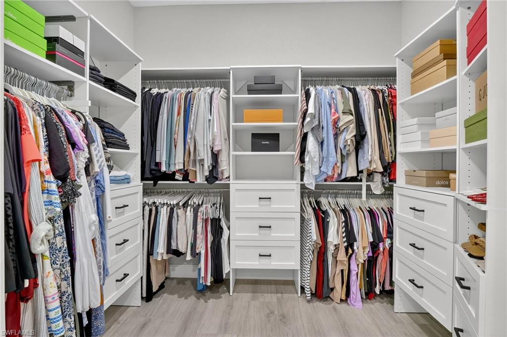 Walk in closet featuring light wood-type flooring