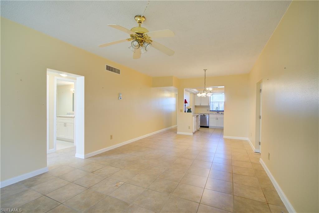 Main living area looking into kitchen and hallway to bathroom.