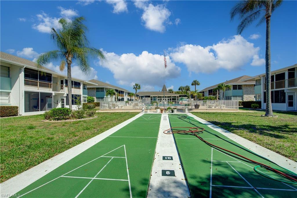 View of property's community with shuffleboard