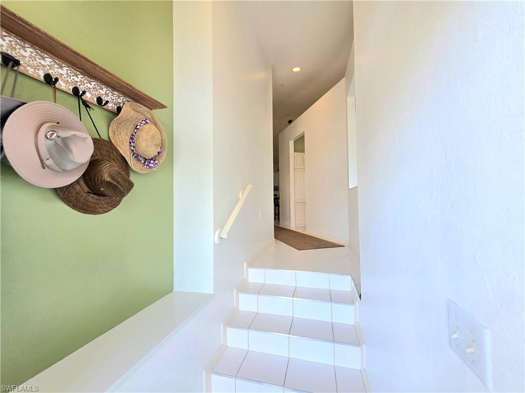 Stairway featuring recessed lighting