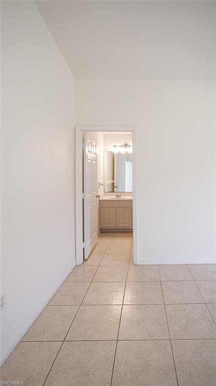 Hall with light tile patterned floors