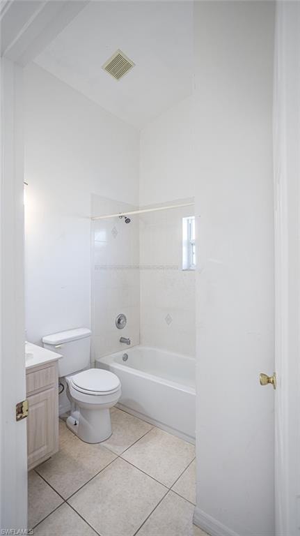 Bathroom with vanity, bathtub / shower combination, and light tile patterned floors