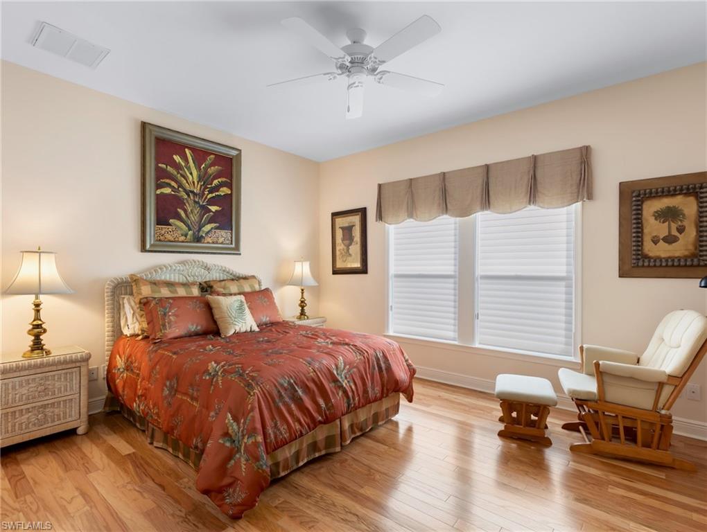 Bedroom 2 at the back of the home overlooking pool area has a full bathroom doubling as a pool bath.