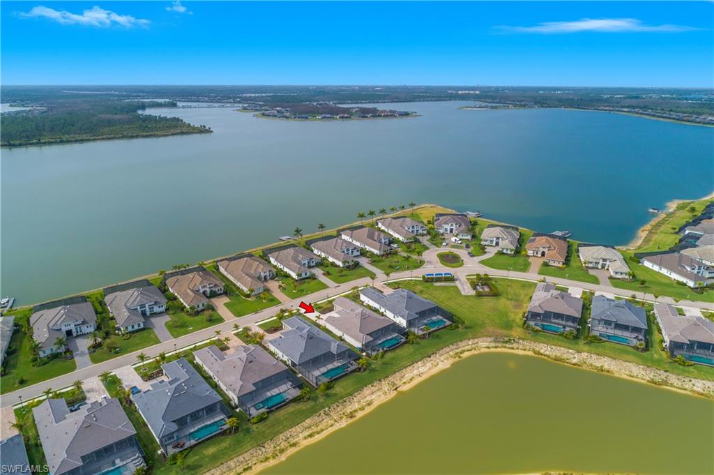 Aerial view of residential area with a large body of water