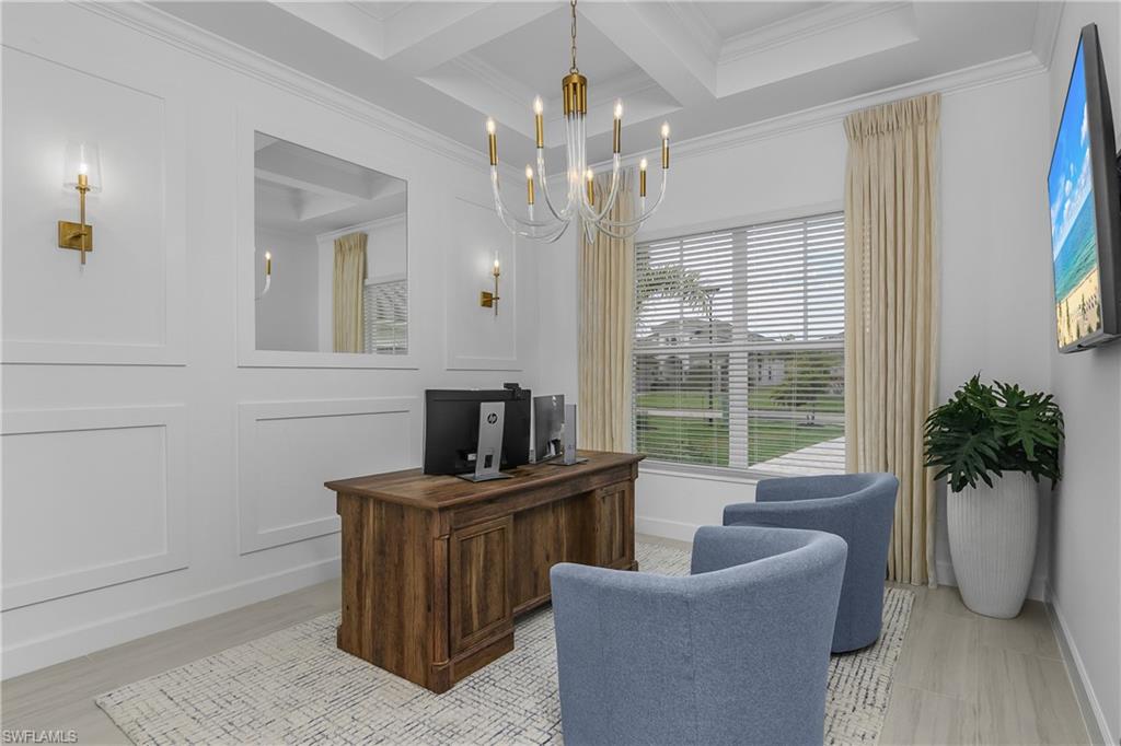 Office area featuring hanging lights, coffered ceiling, and crown molding