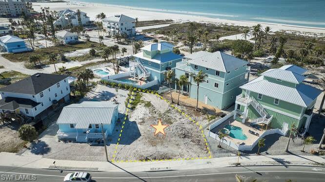 Bird's eye view with a beach view and a water view
