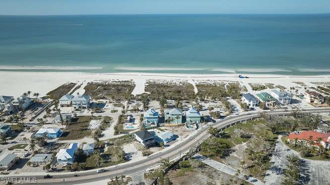 Aerial view with a beach view and a water view
