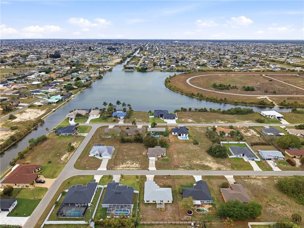 Aerial overview of property's location featuring nearby suburban area and a large body of water