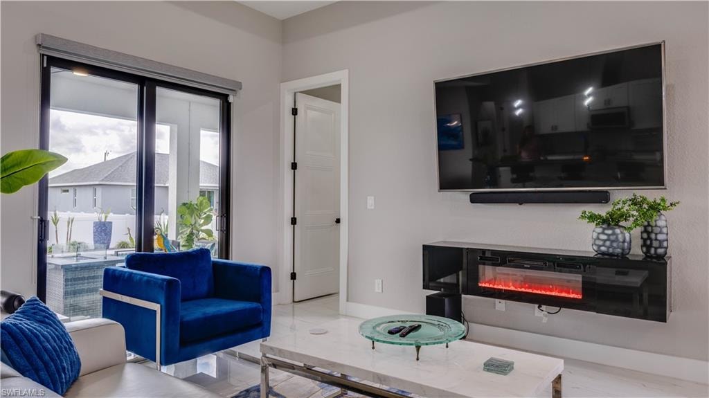 Great room area with floating fireplace which conveys.