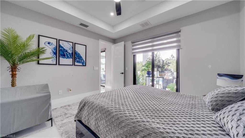 Primary Bedroom with access to pool/lanai