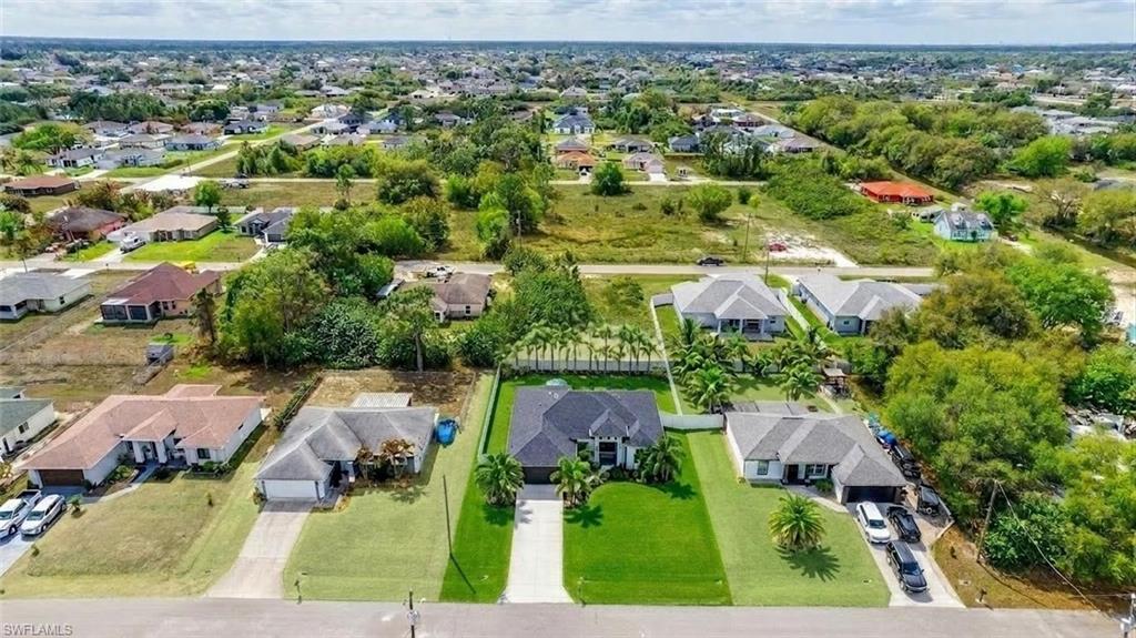 Aerial perspective of the front of the property. (Virtually enhanced)