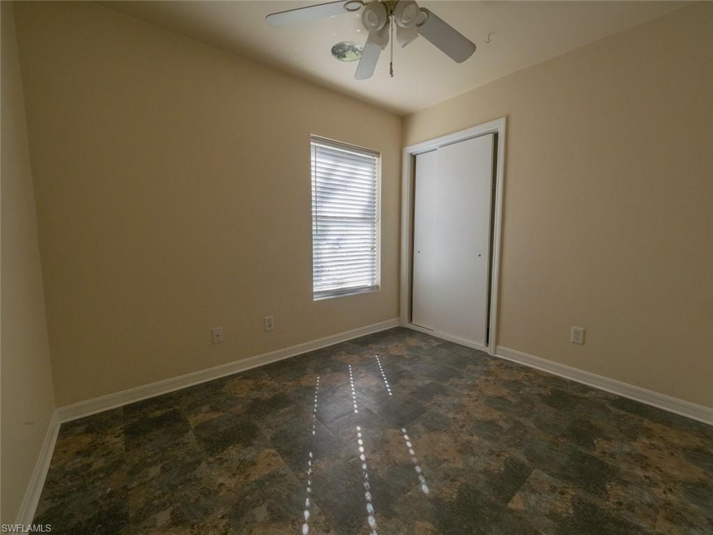 Spare room featuring ceiling fan