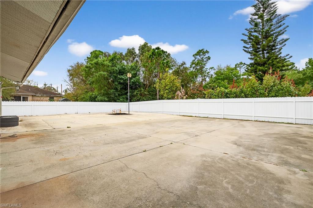 Fenced backyard featuring a patio