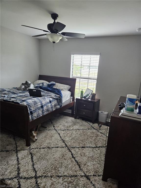 Bedroom featuring a ceiling fan