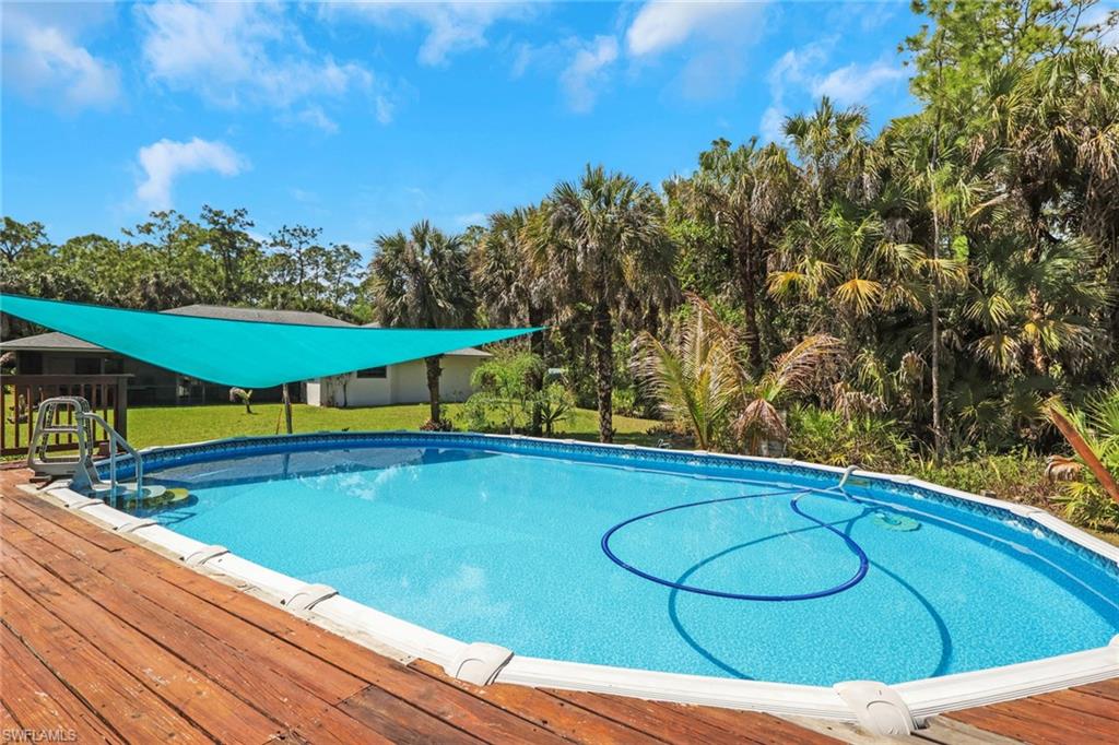 Oversized pool with wood decking. Perfect space to relax and enjoy SWFL beautiful weather.