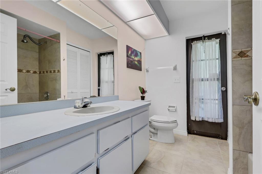 Guest Bathroom with tub/shower combo and access to the lanai.
