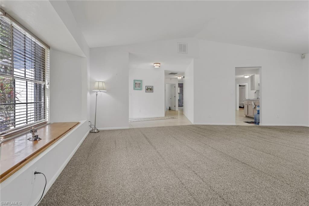 Spacious front living area with window seating giving you added storage. High ceilings and tons of natural lighting.
