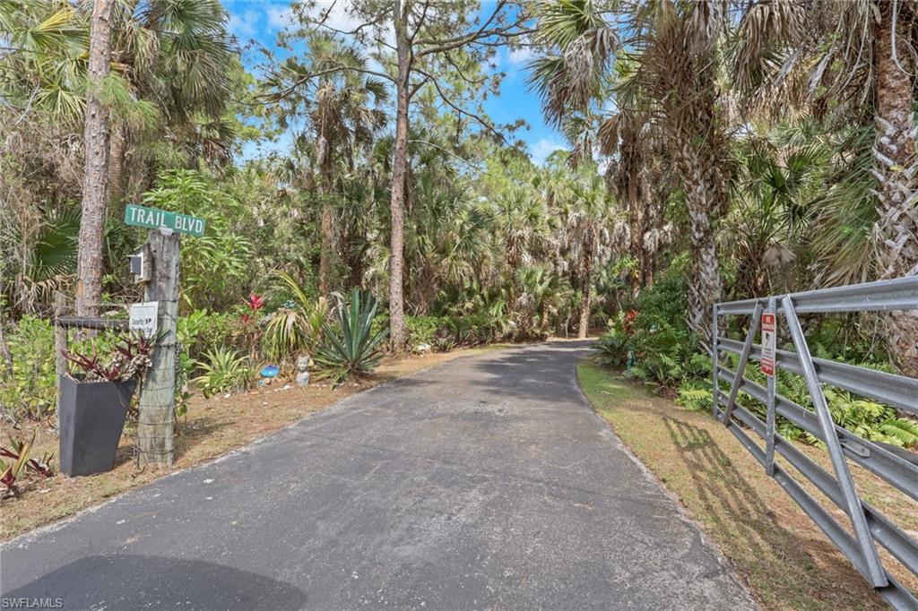 Gated main entrance. Long asphalt circular driveway with tons of space to park multiple vehicles. Home is nicely set back and private! Second gated entry off of Wilson Blvd N! Fully Fenced!