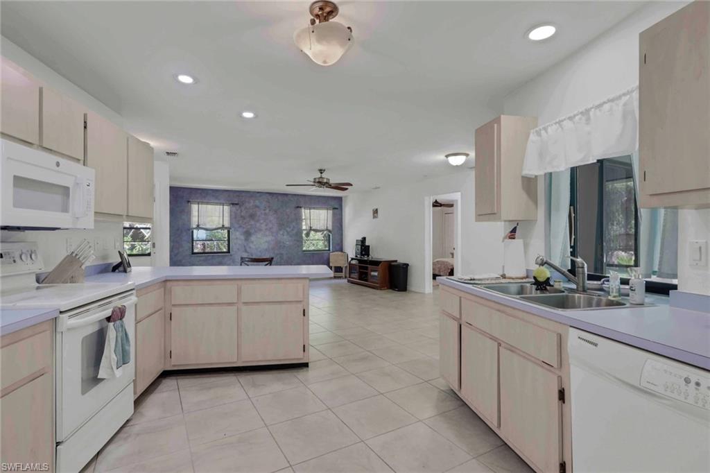 Spacious kitchen giving you access to the front living/dining area and back family room/dining room