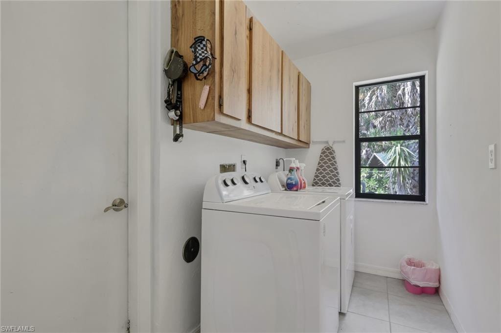 Laundry room with storage. Utility sink in the garage.