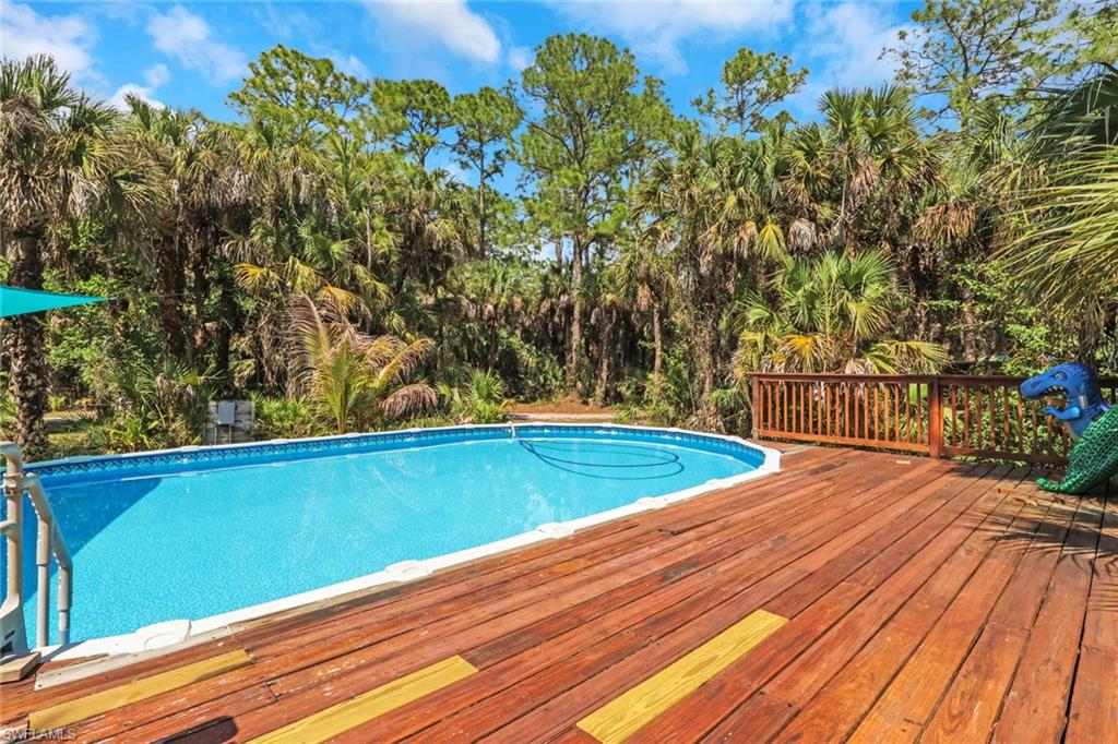 Oversized pool with wood decking. Perfect space to relax and enjoy SWFL beautiful weather.