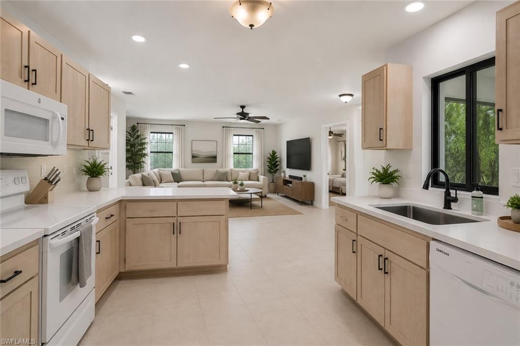 Virtually staged. What the kitchen could look like with just a few updates (hardware, countertops) Spacious family room off the kitchen.