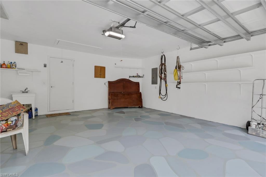 Spacious two car garage with utility sink. Hurricane proof garage door.