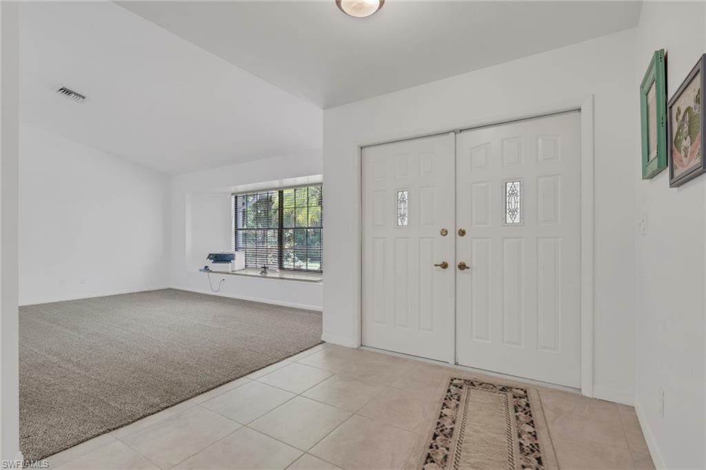 Double door front entrance with a foyer. Large Living and dining area.
