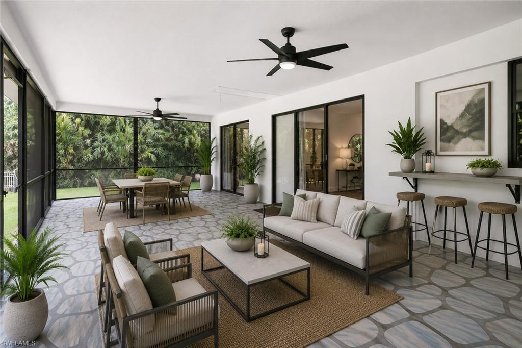 Virtually Staged. Spacious Enclosed Lanai with a beautiful view of the pool and backyard space! Great space for entertaining!