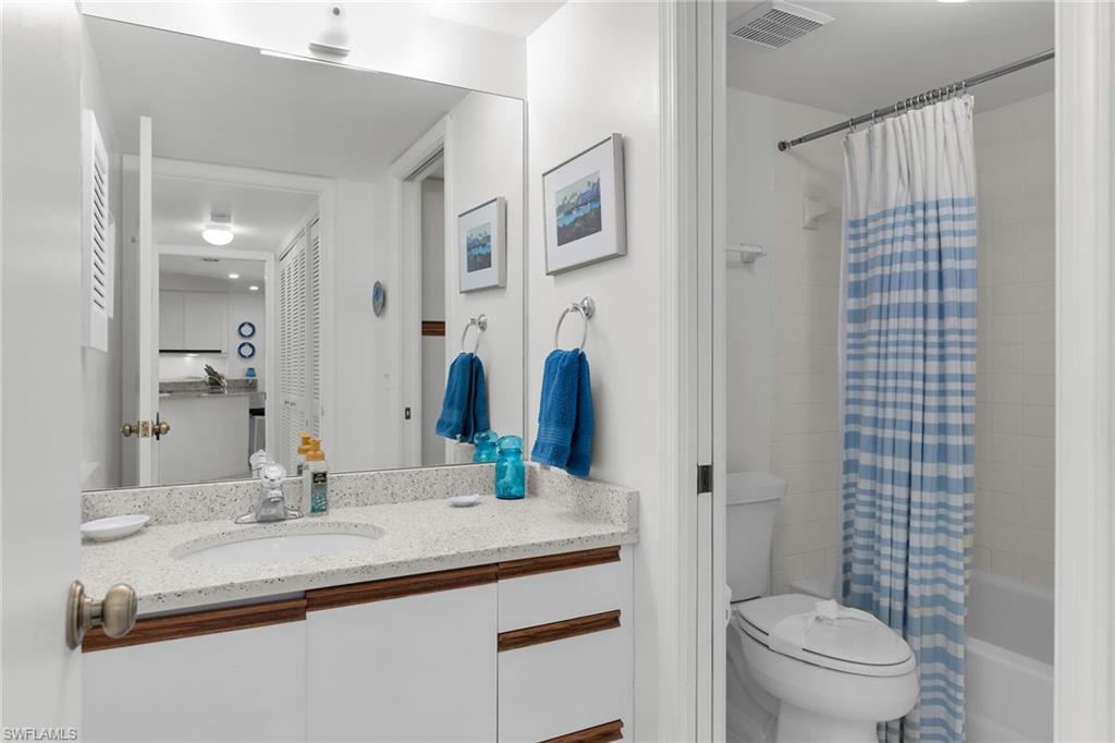 Bathroom with vanity and shower / tub combo