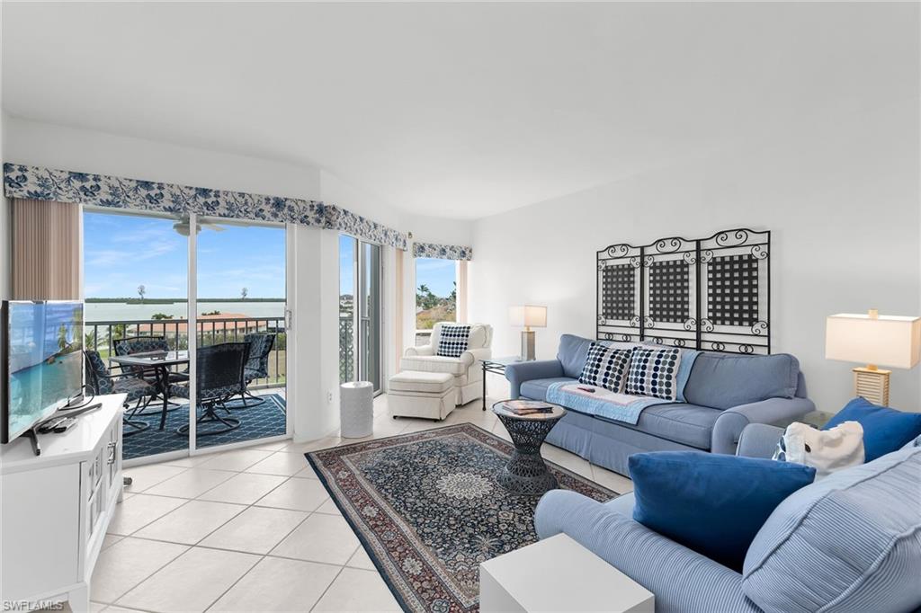 Living area featuring light tile patterned floors