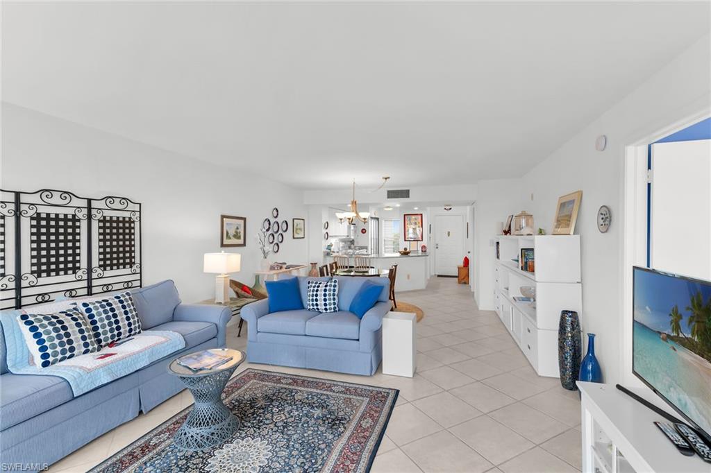 Living room featuring light tile patterned flooring