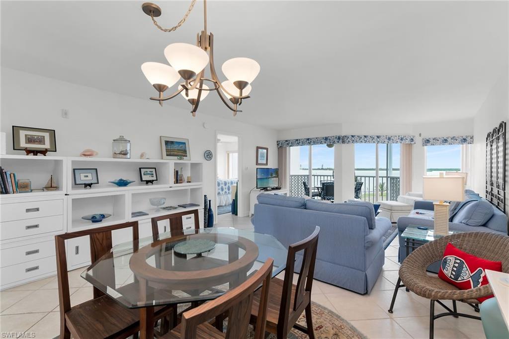Dining area featuring a chandelier and light tile patterned flooring