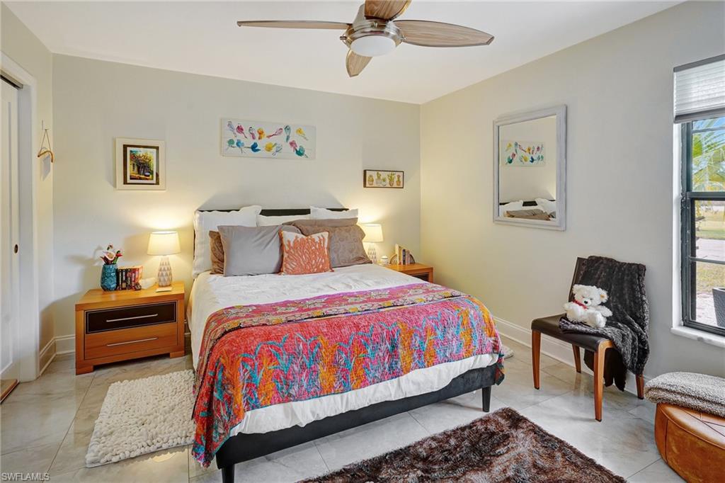 Bedroom featuring baseboards and ceiling fan