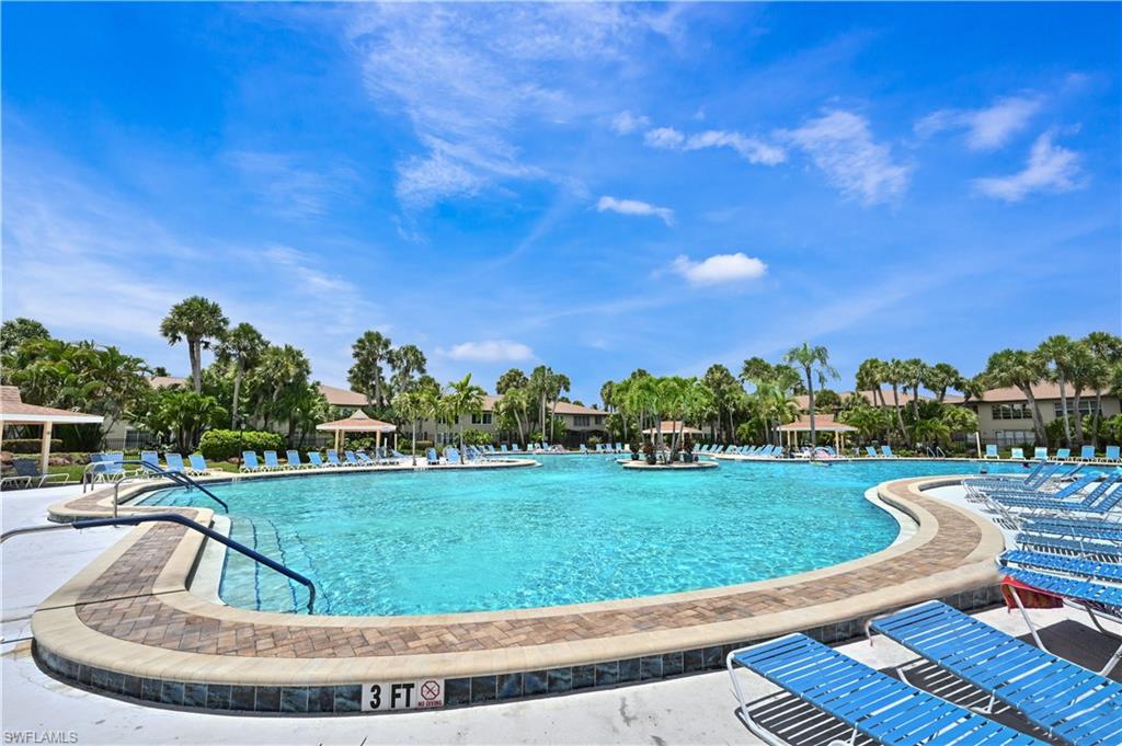 Community pool with a patio
