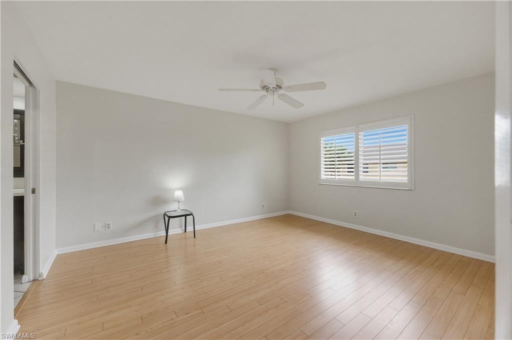 Master Bedroom with light wood-style flooring and ceiling fan