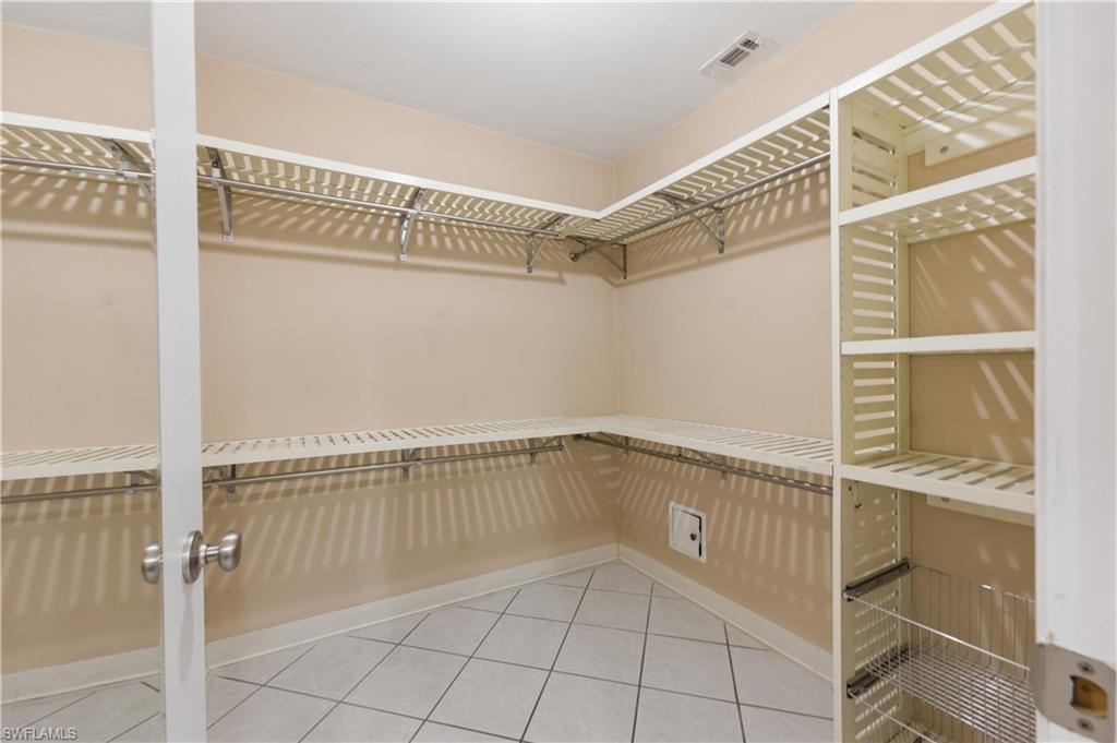 Walk in closet featuring light tile patterned flooring