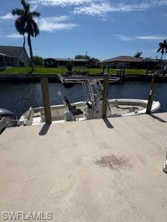 Dock with a water view and boat lift