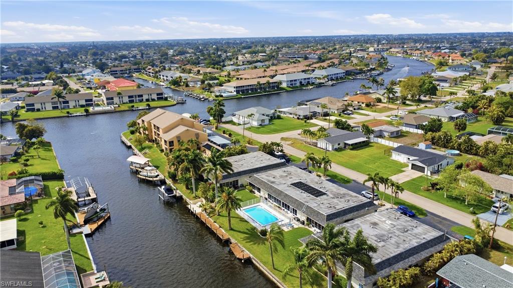 Aerial overview of property's location highlighting views of the Caloosahatchee River and nearby Downtown Cape Coral