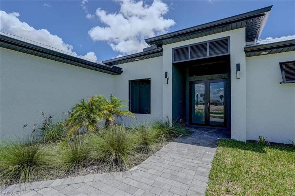 Doorway to property with glass french doors