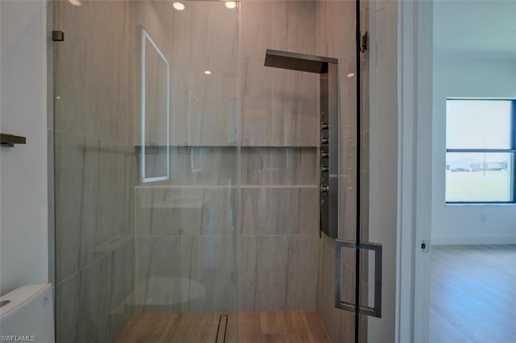 Bathroom featuring toilet and hardwood / wood-style floors